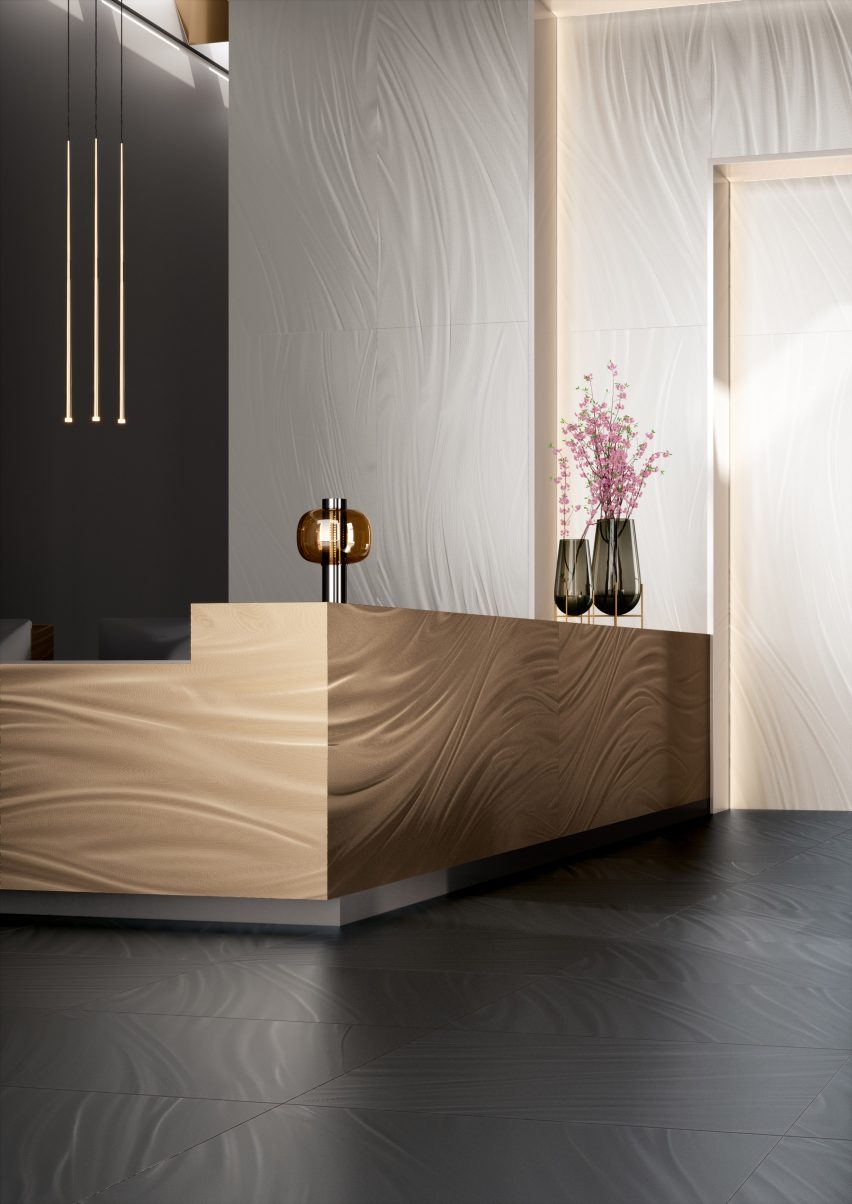 Luce tiles in gold used on a front desk in an reception-like setting and Luce tiles in white used on the walls
