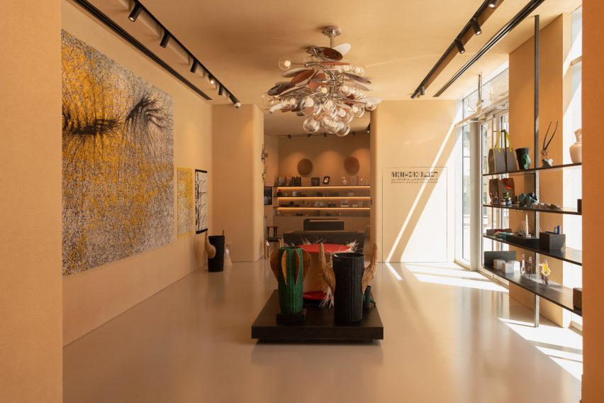 Crafts exhibited in a beige room at Menasa
