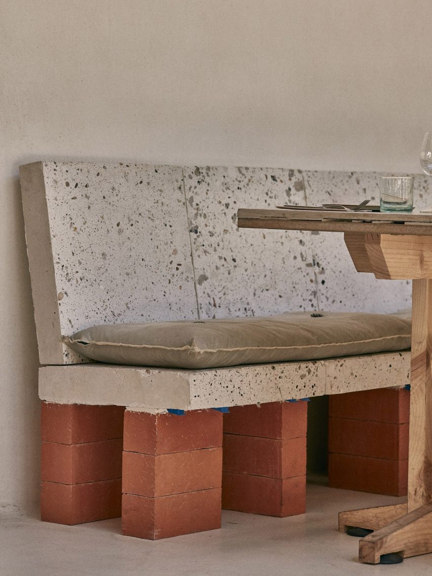 Bench made from upcycled waste tiles and supported by bricks as the base