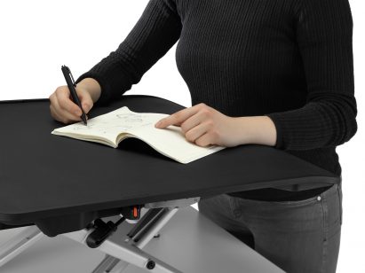 Writing on a Monto sit stand riser