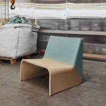 Gradient blue and yellow Ermis chair by The New Raw in an industrial warehouse