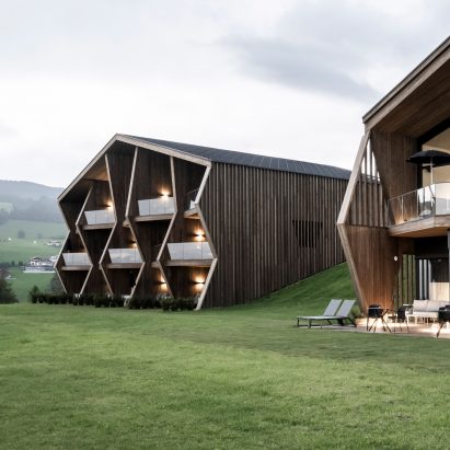 Aeon Hotel is a timber-clad hotel in Italy with a jagged facade