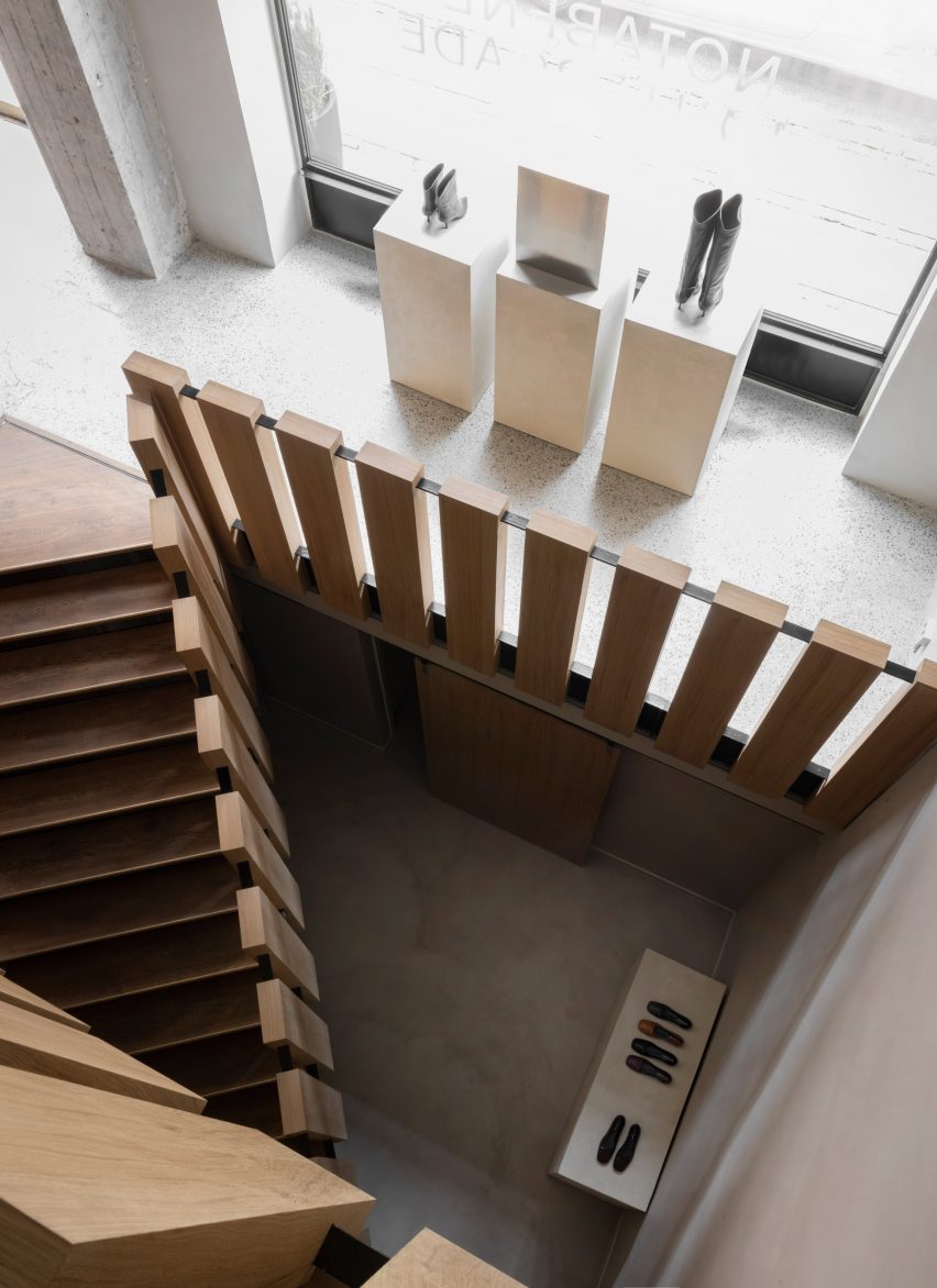 Oak staircase features in Notabene shoe store designed by Norm Architects