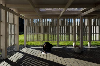 A child pictured drawing in the Rainbow Pavilion