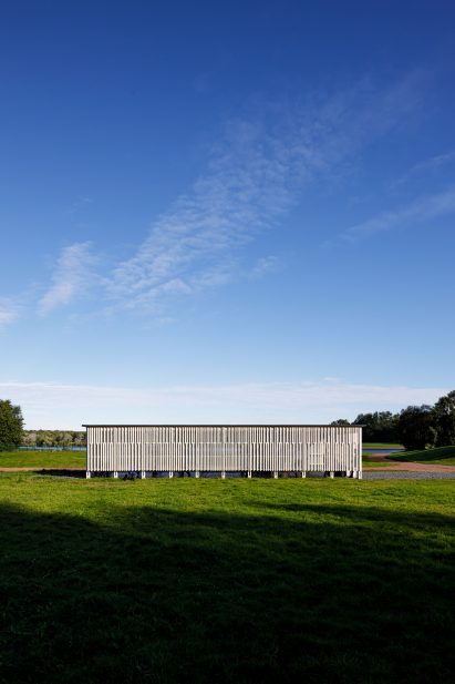 The Rainbow Pavilion has a wood slatted exterior
