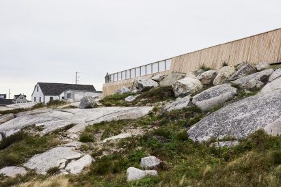 Wooden guardrails atop stone landscape