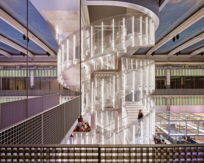Spiral staircase surrounding by vertical light bars