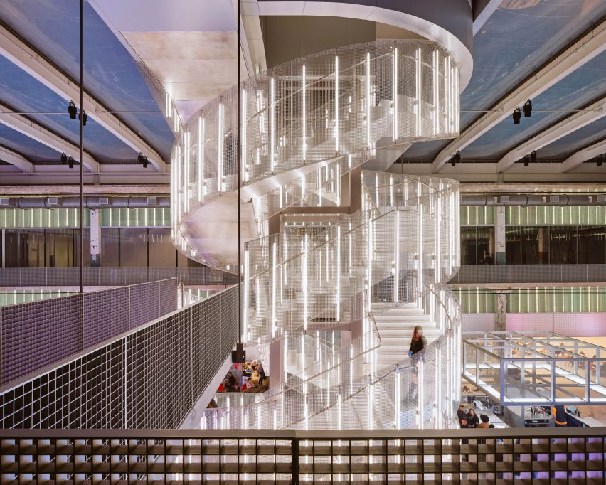 Spiral staircase surrounding by vertical light bars