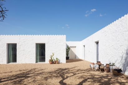 View of Casa da Volta from the white-walled courtyard