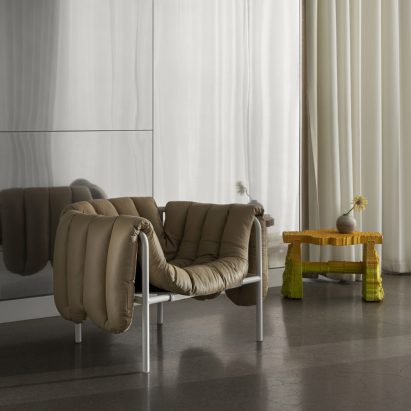 Lounge chair by Faye Toogood for Hem with white base and brown leather upholstery