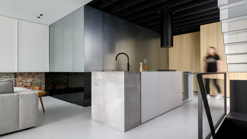 Horizontal line cuts through Amsterdam loft revamped by Firm Architects