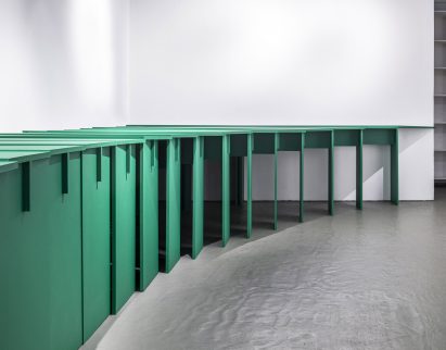 Row of interlocking green tables by Lanza Atelier for Storefront for Art and Architecture