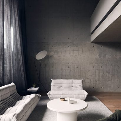 White Togo sofa and armchair in living room of Roseneath Street apartment by Studio Goss