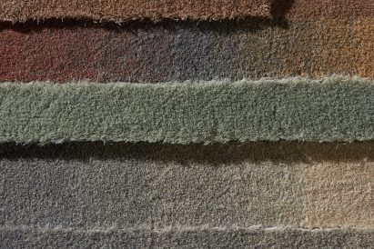 Detail image of the striped tufted design on the Lutetia and Juno rug collection