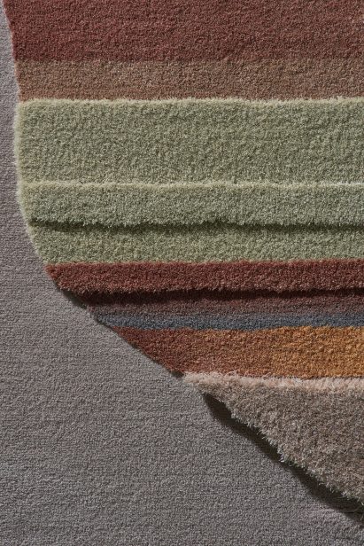The Lutetia and Juno rugs have an amorphous shape tufted onto its face