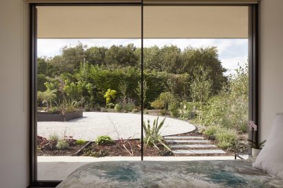 Garden view in Facade of Sayang House by Carlos Gris