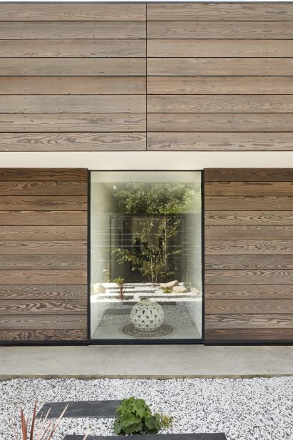 Window to corridor in Facade of Sayang House by Carlos Gris