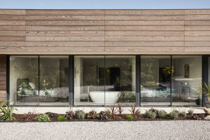 Glazing to bathroom of Facade of Sayang House by Carlos Gris