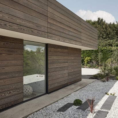 Sie elevation of Facade of Sayang House by Carlos Gris
