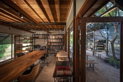 The interior of Sher Maker Studio's workplace with a long table