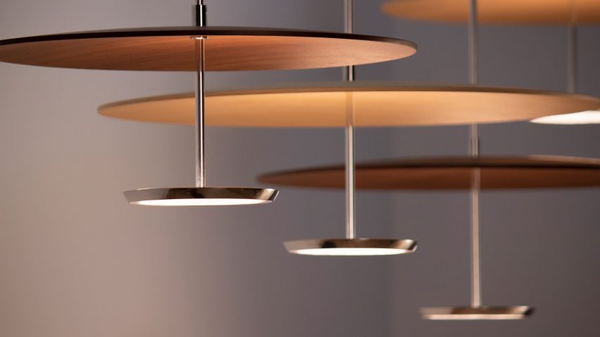 Close up of Pablo Design's Sky Dome pendant lights with pressed wood shades