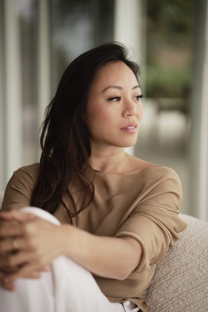 Dara Huang looks away from the camera with a pensive stare