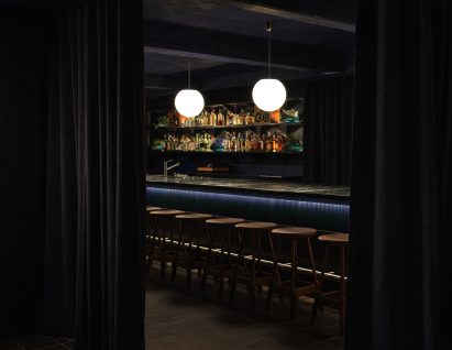 Interior view of SOMA Soho through curtains