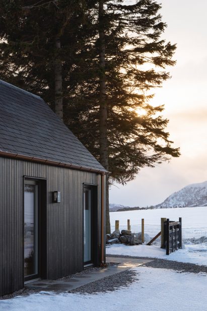 A black timber cottage extension