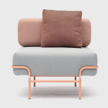 A photograph of a Tangens office furniture chair with pink steel legs and grey and pink seat cushions