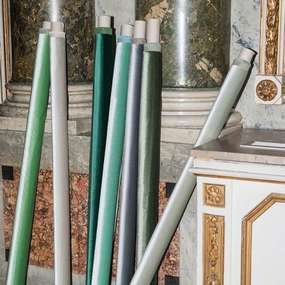 Velvets textiles in green and mint colours rolled up