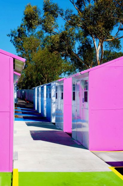 Pink-sided units at Whitsett West Tiny Home Village
