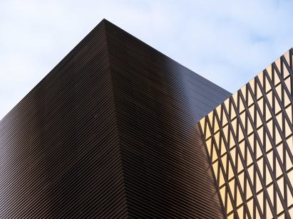 A photograph of the Shanghai Jiuguang Center's upper floors clad in aluminium alloy plates