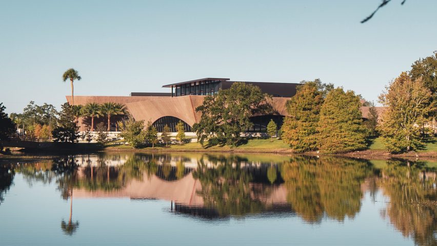 The Winter Park Library & Events Center reflecting against a lake