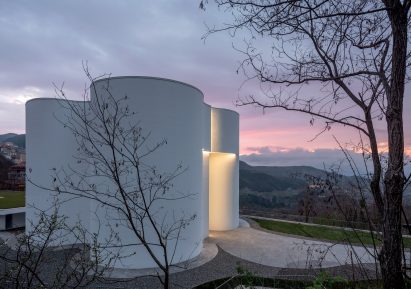 Concrete church with mountain views