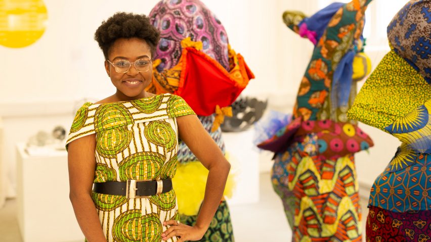 A photograph of a Art and Design student dressed in a colourful print dress