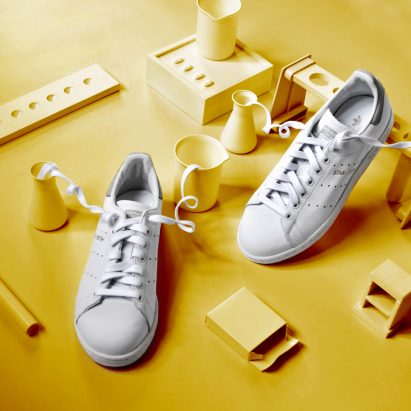 White trainers on a yellow backdrop