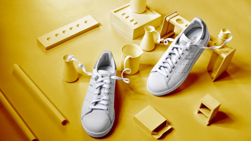 White trainers on a yellow backdrop