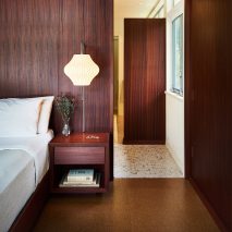 Wood-lined walls in Texas bedroom
