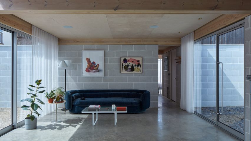 Living room with block walls and timber ceiling