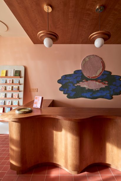 Undulating wooden counter in lifestyle store