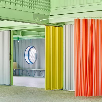 Coloured details including red curtain and yellow screen, Educan school for dogs, humans and other species