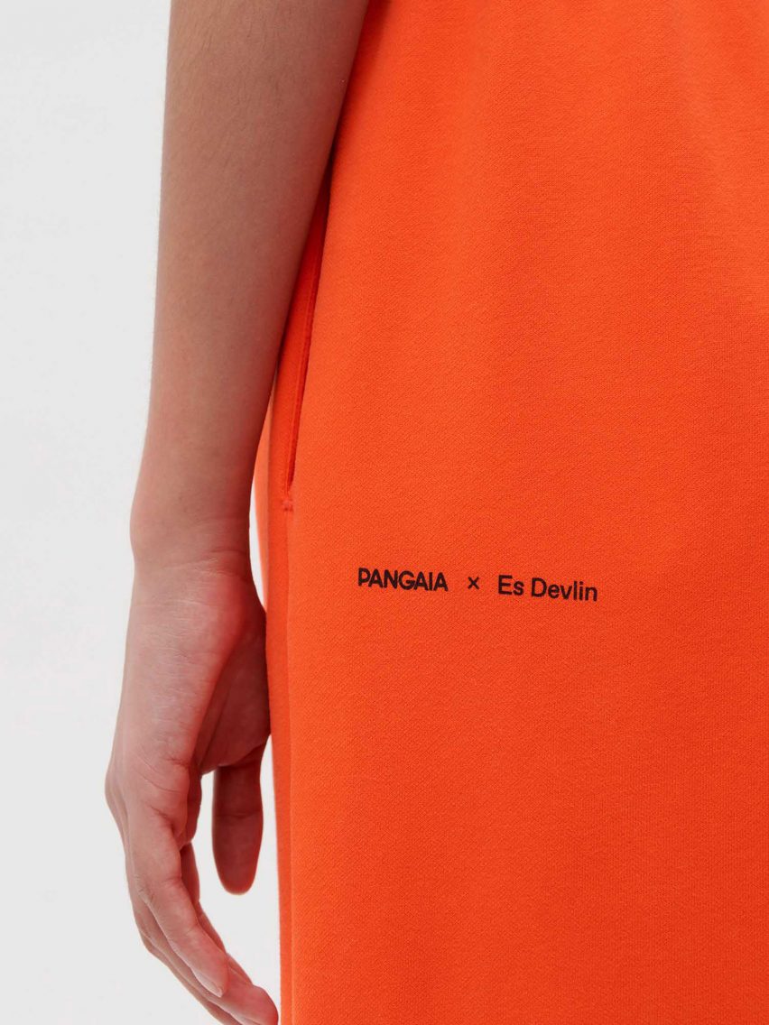 A model wearing Es Devlin's orange clothing for Pangaia