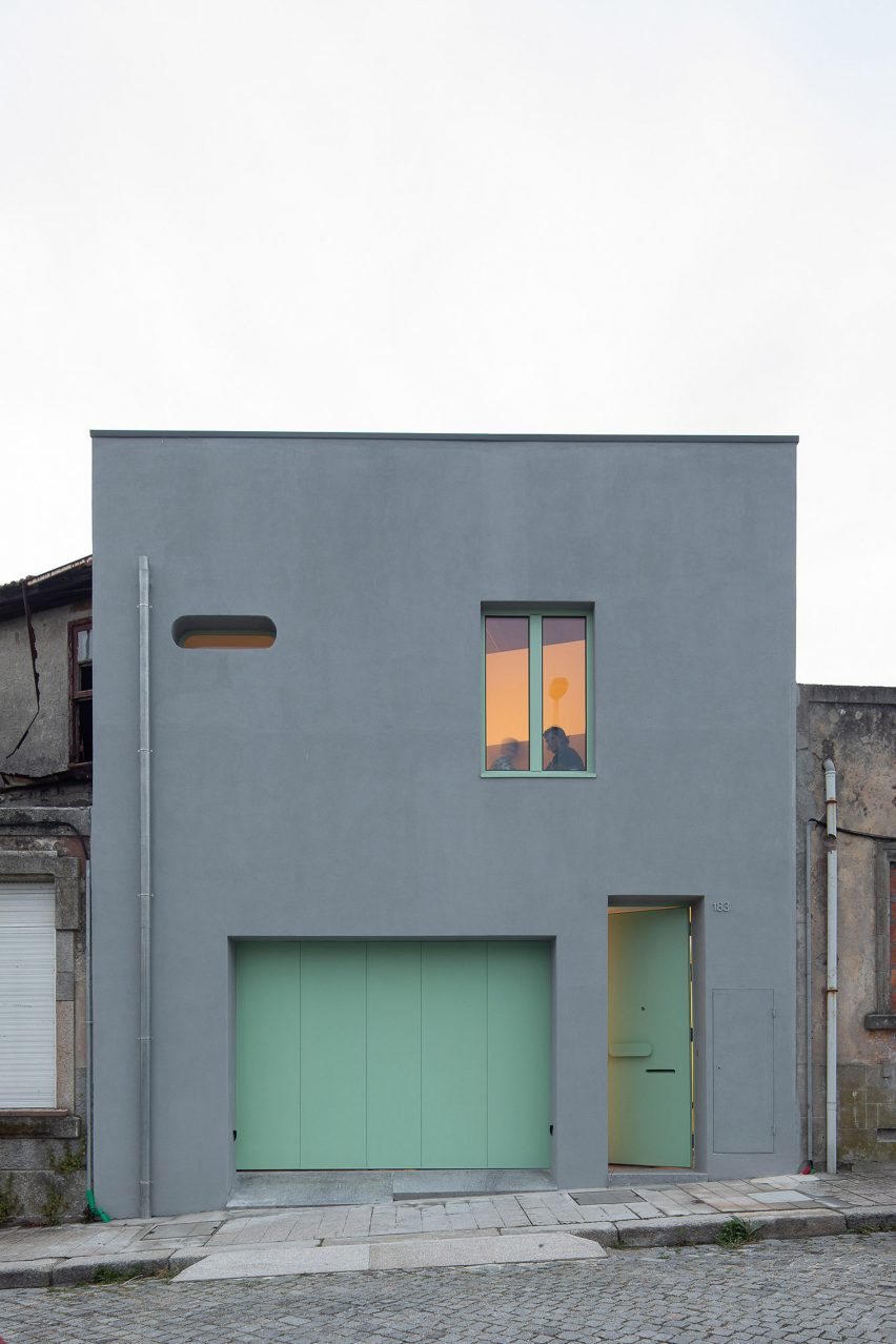 Grey house in Porto with turquoise door