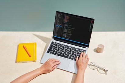 Close-up shot of person coding on a Framework laptop