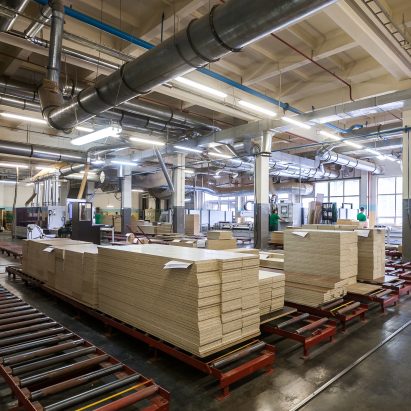 Timber stacked inside a furniture factory
