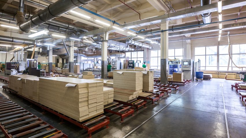A furniture factory filled with stacked timber