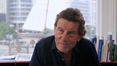 A still of Helmut Jahn speaking from the film In a Flash
