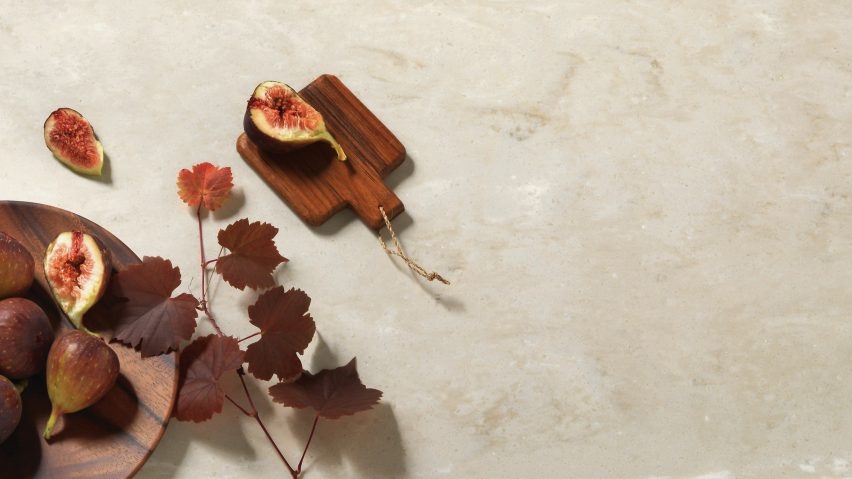 Beige marble- effect finish Aurora Bisque by HI-MACS with figs displayed on top