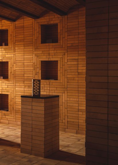 Brick by Indal Mechno Bricks displayed on a plinth also made from bricks