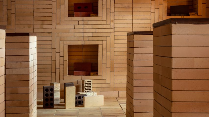 Bricks displayed in niches and on floor of Indal Mechno Bricks showroom by Renesa